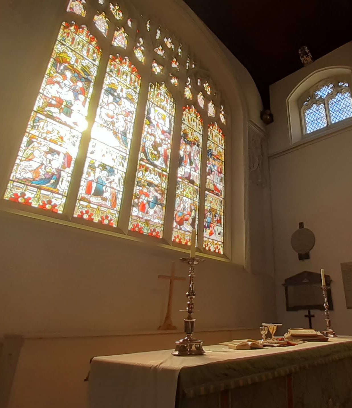 Sunlit stained glass at High Altar